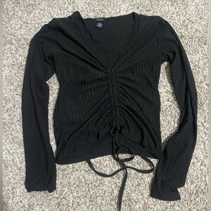 Black shirt with adjustable strips in the front